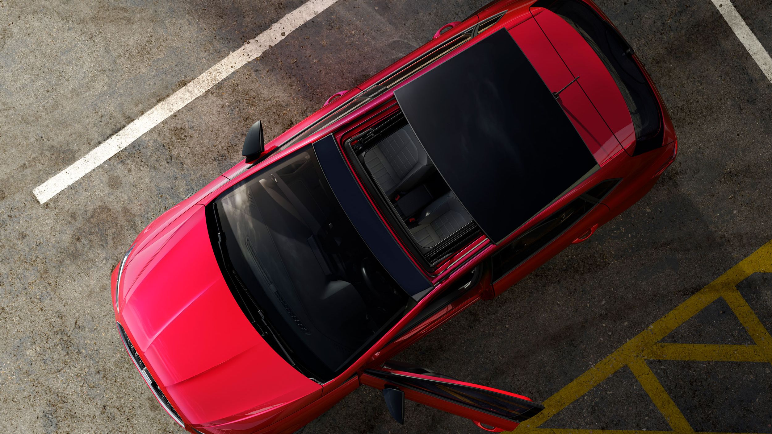 Pohled shora na SEAT Ibiza s otevřeným střešním oknem. 